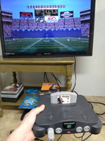 n64 with controllers and memory cards